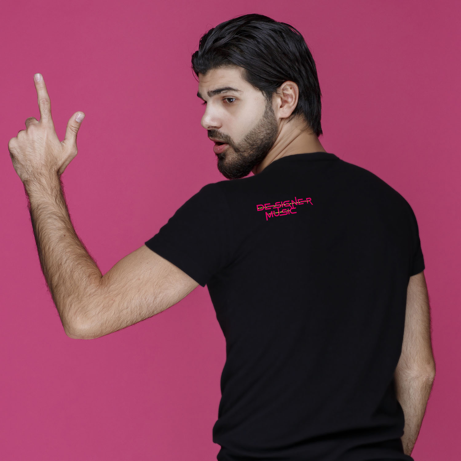 Man in black shirt showing direction, view from behind